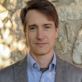 headshot portrait of Paul Kunz