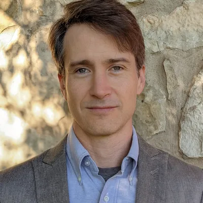 headshot portrait of Paul Kunz